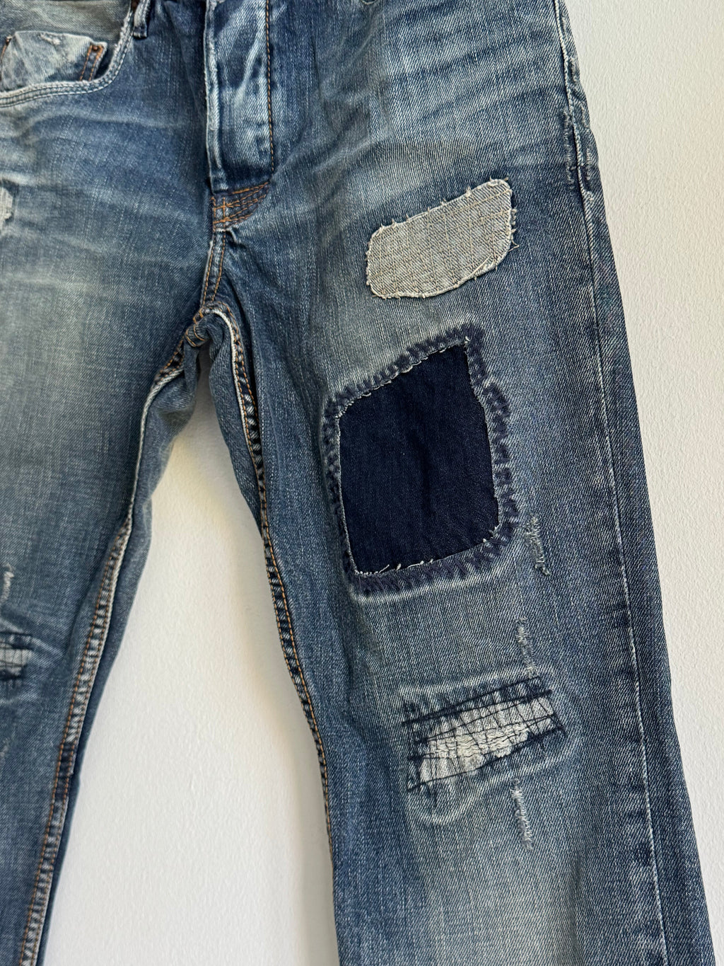 SEWN & DISTRESSED PATCHWORK JEANS