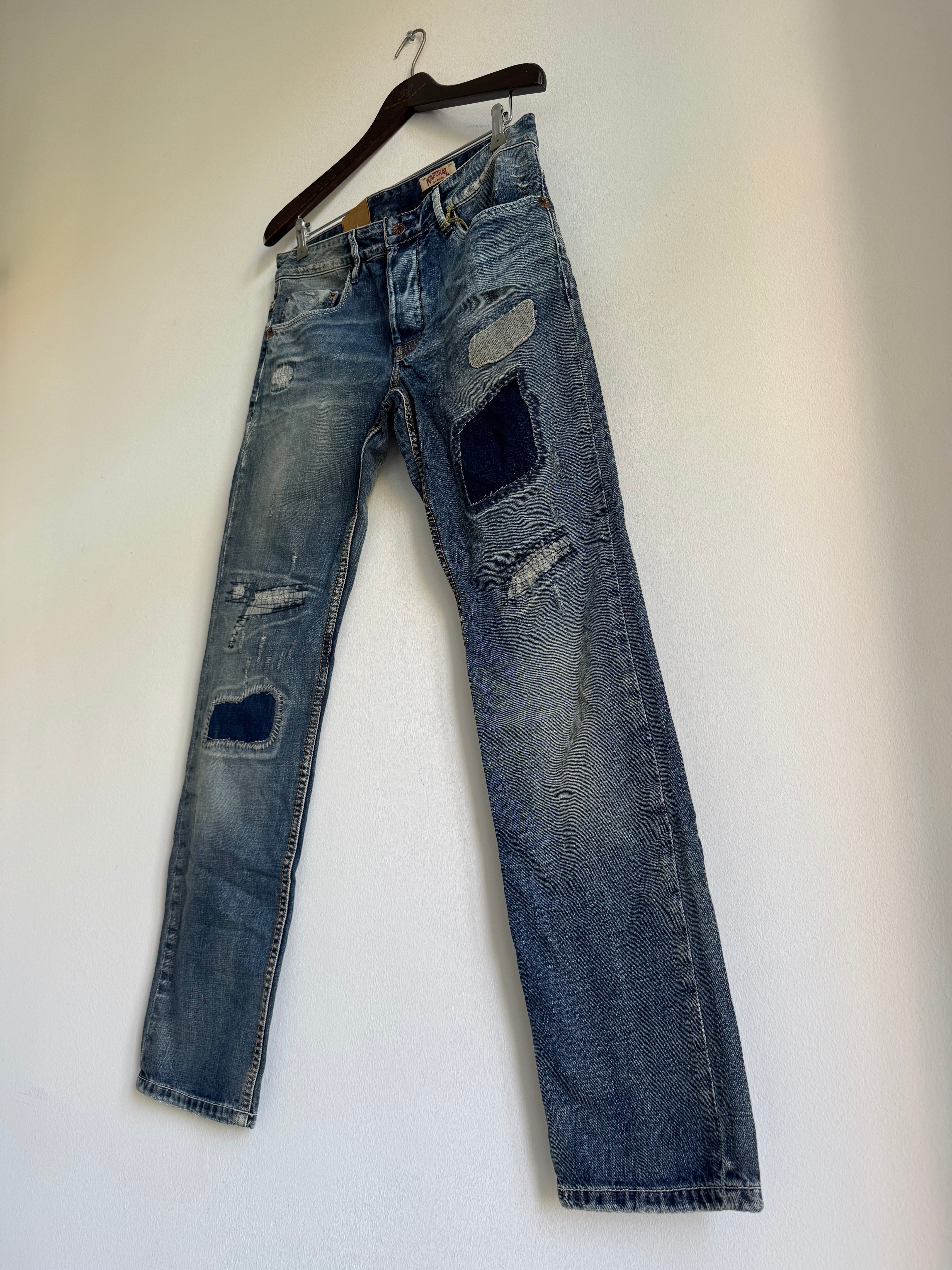 SEWN & DISTRESSED PATCHWORK JEANS